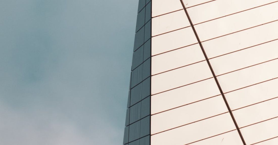 Omega-3 - Modern Skyscraper On a Blue Sky