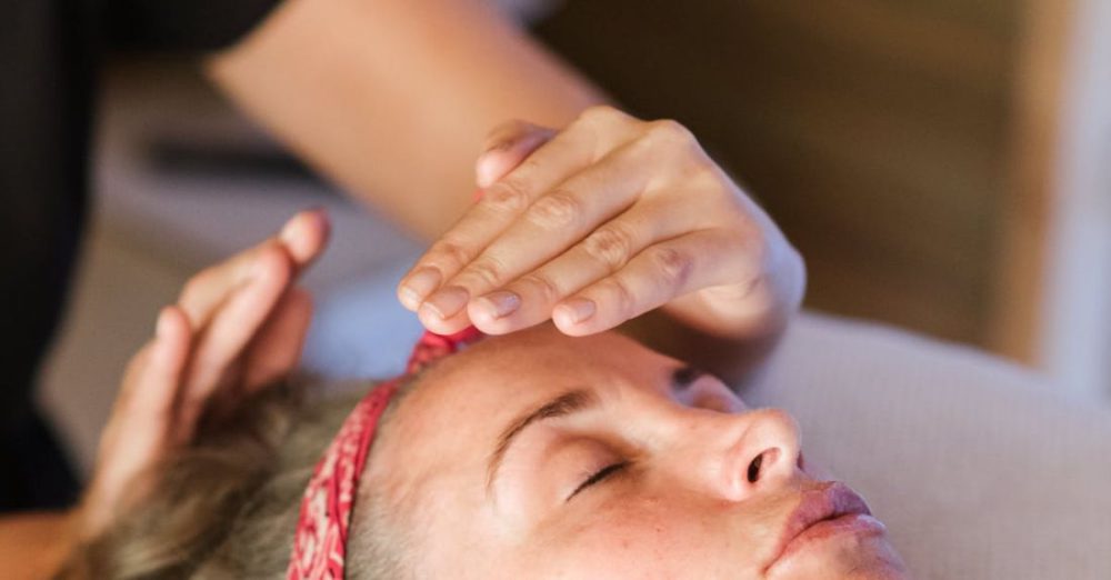 Reiki - Relaxed woman getting alternative massage