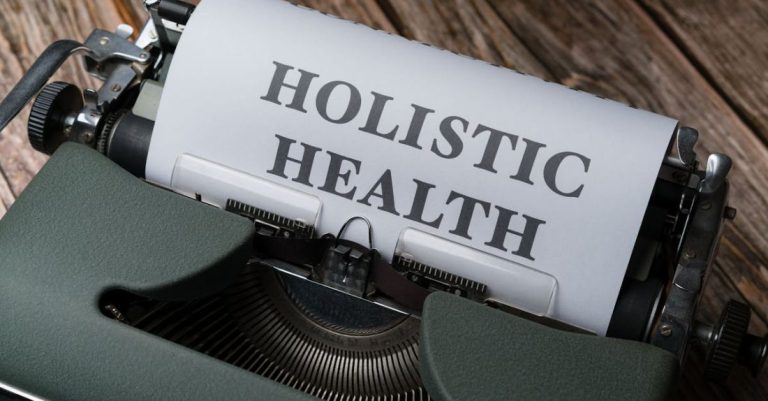 Integrative Medicine - A typewriter with the word holistic health on it