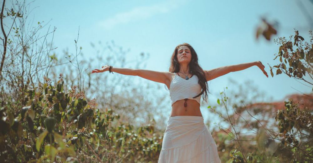 Yoga Styles - Woman Spreading Both Her Arms