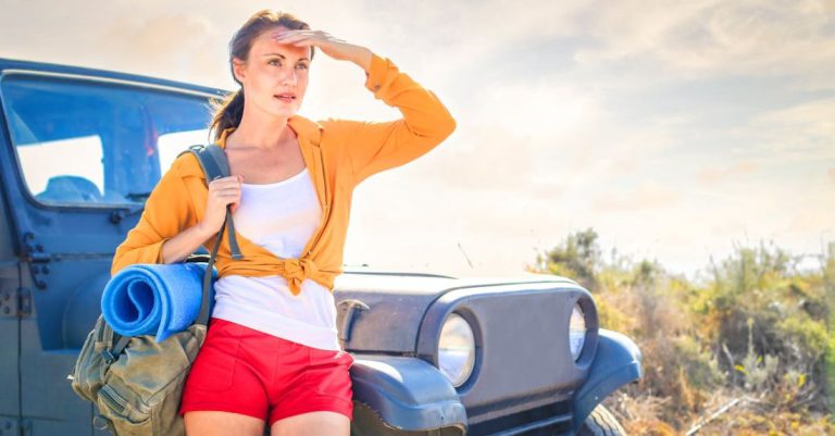 Hot Yoga - Woman in Yellow Long Sleeve Leaning on Blue Car