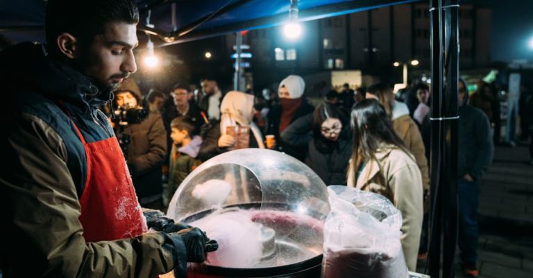 Sugar Intake - A man in an apron is making a snow cone