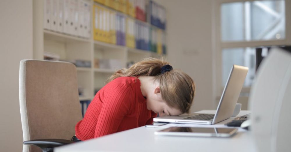 Technology Sleep - Woman Sitting on Chair While Leaning on Laptop