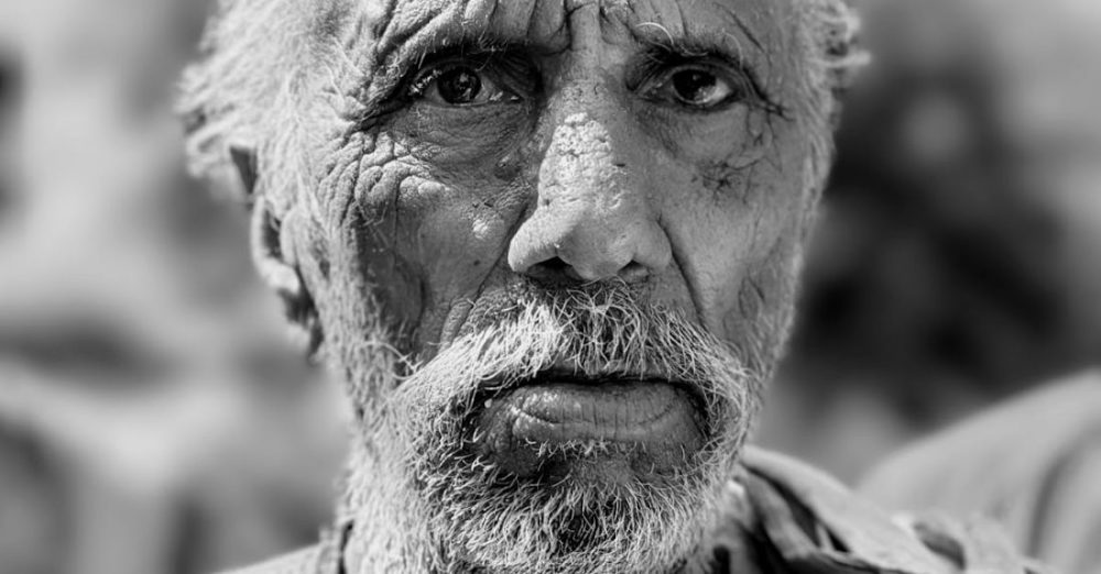 Reduce Wrinkles - An old man with a beard and a scarf